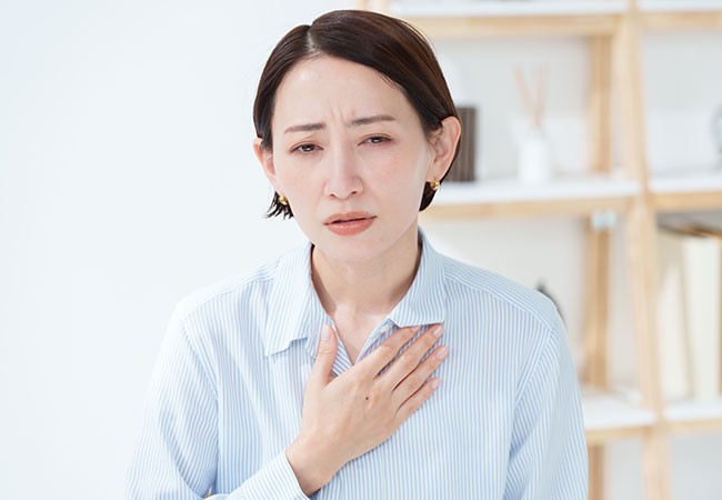 体調の悪い女性